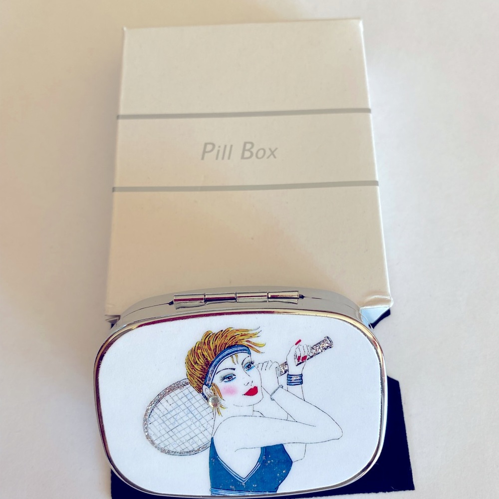 Beautiful enameled decorated pill box portraying a lady with tennis racket.